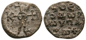 PB Byzantine lead seal of Theodore hypatos (AD 6th–7th centuries)
Obv: Cruciform invocative monogram (type V): Θεοτόκε βοήθει. Wreath border.
Rev: I...
