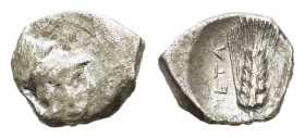 Italy, Lucania. Metapontion. Circa 325-275 BC. Diobol (11 mm, 1 g). Head of Athena to right, wearing Corinthian helmet. R/ META. Grain ear with leaf t...