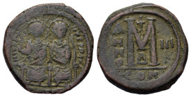 Justin II, with, Sophia. Æ 40 Nummi (29 mm, 16 g) Constantinople. D N IVSTINVS P P AI, nimbate imperial couple seated facing on double throne. R/ Larg...