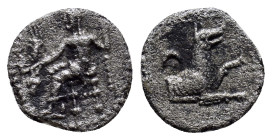 LYCAONIA, Laranda. Circa 324/3 BC. AR Obol (11mm, 0.6 g). Baaltars seated left, holding grain ear, grapes, and scepter / Forepart of wolf right; inver...
