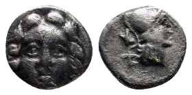 Pisidia. Selge circa 350-300 BC. Obol AR (9mm, 1.0 g) Gorgoneion. / Head of Athena to right, wearing crested Attic helmet; behind, astragalos.