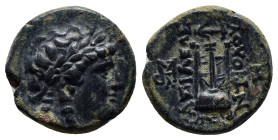 SELEUKID KINGDOM. Antiochos II Theos (261-246 BC). Ae. (17mm, 5.0 g) Sardes. Obv: Laureate head of Apollo right. Rev: BAΣΙΛΕΩΣ / ANTIOXOY. Tripod. Con...
