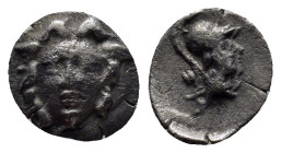 Pisidia. Selge circa 350-300 BC. Obol AR (9mm, 0.8 g) Gorgoneion. / Head of Athena to right, wearing crested Attic helmet; behind, astragalos.