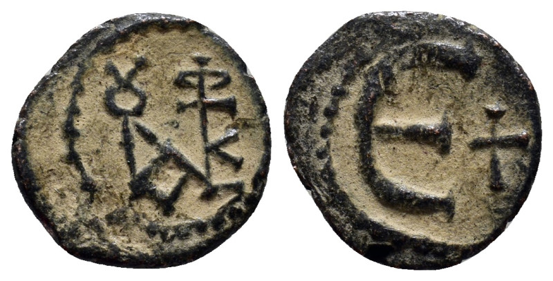 Justin II Æ 5 Nummi. (14mm, 1.6 g) Antioch, AD 569-578. Monogram / Large E, cros...