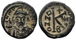 Maurice Tiberius. 582-602. Æ half follis (21mm, 4.5 g). Thessalonica mint, helmeted and cuirassed bust facing, holding globus cruciger and shield / La...