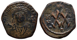 Maurice Tiberius. 582-602. Æ half follis. (21mm, 6.2 g). Theoupolis (Antiochia) mint. His crowned bust facing, wearing consular robes, holding mappa a...