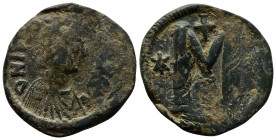 Justinian I. 527-565. Æ Follis (32mm, 18.2 g). Struck 527-538. Diademed, draped, and cuirassed bust right / Large M; cross above, vertical star.