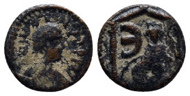 Justin I, 518-527 AD. Æ Pentanummium (13mm, 1.6 g) of Antioch. Laureate draped bust / Tyche seated, E, all within shrine.