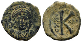 Justinian I Æ 20 Nummi. (27mm, 10.1 g) Theoupolis (Antioch), dated RY 25 = AD 551/2 . [D N IVSTINIANVS P P AVG], helmeted and cuirassed bust facing, h...