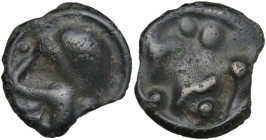 Celtic World. Northwest Gaul, Senones. AE Potin Unit. c. 100-50 BC. Obv. Stylised helmeted male head left. Rev. Stylized horse prancing left; four pel...