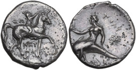 Greek Italy. Southern Apulia, Tarentum. AR Nomos, c. 280-272 BC. Obv. Horseman right, crowning horse. Rev. Phalanthos riding on dolphin left, holding ...