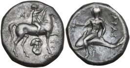 Greek Italy. Southern Apulia, Tarentum. AR Nomos, c. 272-240 BC. Obv. Nude youth on horseback right, crowning horse and holding rein; monogram to left...