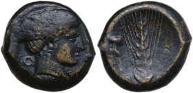 Greek Italy. Southern Lucania, Metapontum. AE Obol, c. 400-340 BC. Obv. Head of Nike right; behind, O; below, NIKA. Rev. Ear of barley; to left, herm....