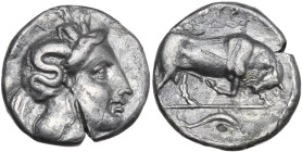 Greek Italy. Southern Lucania, Thurium. AR Stater, 350-300 BC. Obv. Head of Athena right, wearing crested Attic helmet decorated with Scylla holding t...
