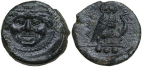 Sicily. Kamarina. AE Tetras, c. 425-405 BC. Obv. Gorgoneion. Rev. Owl standing right, head facing, wings closed, holding lizard; in exergue, three pel...