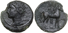 Punic Sardinia. AE 16 mm, late 4th-early 3rd century BC. Obv. Head of Tanit left, wearing wreath of grain. Rev. Horse standing right in front of palm ...