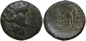 Continental Greece. Thrace, Maroneia. AE 27 mm, c. 168-45 BC. Obv. Head of Dionysos right, wearing ivy-wreath. Rev. Dionysos standing left, holding bu...