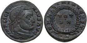 Licinius I (308-324). AE Follis, Arelate mint. Obv. IMP LICI-NIVS AVG. Laureate head right. Rev. DN LICINI AVGVSTI. VOT/ •/ XX within wreath; in exerg...