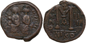 Justin II (565-578). AE Follis, Nicomedia mint, RY 9 (573/4 AD). Obv. [D N IV]STINVS P P AV. Justin and Sophia enthroned facing, both nimbate and crow...