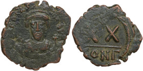Phocas (602-610). AE Half Follis. Constantinople mint. Obv. [ON] FOCAS [PERP AVG]. Crowned bust facing, holding mappa and cross. Rev. Star above large...