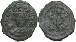 Constans II (641-668). AE Half Follis, Carthage mint. Obv. Bust facing, wearing consular robes and crown with trefoil ornament, holding mappa and glob...