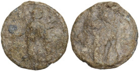 PB Tessera, 1st century BC-1st century AD. D/ Standing figure left, holding uncertain object in extended right hand and leaning on shield set on groun...