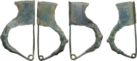 Italic. Pair of bronze bow-shaped fibula. 65x33 mm and 65x36 mm. Intact and functional.