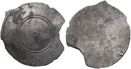 Greek world. Silver miniature shield, at the edge inscription formed by punched dots: ΣΤΡΑ[...]. Edge chipped. Possibly part of a figurine or votive o...