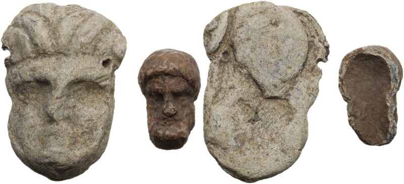 Greek world. Lot of two (2) lead decorative elements in the shape of bearded fac...