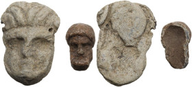 Greek world. Lot of two (2) lead decorative elements in the shape of bearded faces.35x24 mm. and 20x12 mm.
