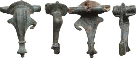 Roman period, 1st-2nd century AD. Lot of two (2) bronze dolphin-shaped fibulae.