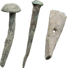 Roman period. Lot of three (3) bronze and lead items, including two nails and a lead object in the form of a small pickaxe. Good preservation, no trac...