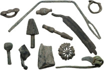 Miscellanea. Roman period to the Renaissance. Lot of twelve (12) bronze items, including parts of a fibula, military and civil objects.