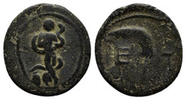 Pisidia. Etenna circa 100-0 BC. Bronze Æ (17mm, 2.5 g). Nymph advancing right, head left, holding serpent, vase to left / E T, sickle-shaped knife or ...