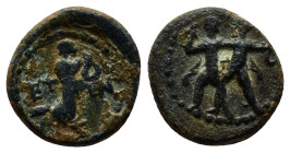 Pisidia, Etenna. 1st century B.C. AE (13mm, 2.1 g) Nymph advancing right; in front, coiled snake, behind, jug. / Two men standing side by side; the le...