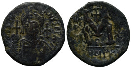 Justinian I. 527-565. Æ follis (34mm, 18.5 g). Theoupolis (Antioch) mint. Helmeted and cuirassed bust facing, holding globus cruciger and shield; cros...