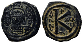 Maurice Tiberius. 582-602. Æ half follis (22mm, 4.9 g). Thessalonica mint, D N MAVRC TIB PP AVG, helmeted and cuirassed bust facing, holding globus cr...