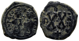 Phocas, with Leontia. 602-610. Æ half follis. (21mm, 6.6 g) Theoupolis (Antioch) mint. Phocas on left, holding globus cruciger, and Leontia on right, ...