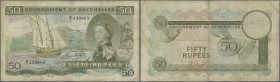Seychelles: 50 Rupees January 1st 1972 with signature: Bruce Greatbatch, P.17d, still nice ”Sex”-note with toned paper and several folds. Condition: F...