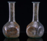 Romain - Flacon en verre irisé - 100 / 300 av. J.-C.
Joli petit flacon en verre irisé translucide à panse globulaire à 5 faces, col long et étroit av...