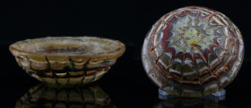 Romain - Coupelle en pâte de verre - 0 / 300 ap. J.-C.
Coupelle en pâte de verre de couleur marron clair, ornée sur le dessous de l'objet, d'un filet...