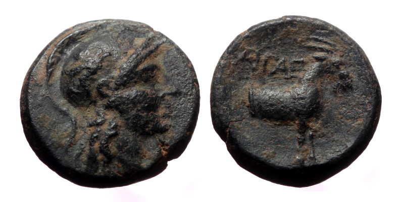 Aeolis, Aigai, AE,(2.06 g 13mm), 2nd-1st Centuries BC.
Obv: Helmeted head of Ath...