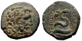 Mysia, Pergamon.AE,(Bronze, 7.40 g, 21mm), Circa 133-27 BC.
Obv: Laureate head of Asklepios right
Rev. Serpent coiled around omphalos right, surmoun...