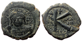 Justinian I (527 - 565) AE, Half Follis (Bronze, 6.38 g. 22mm.) Thessalonica. 527-565 AD. 
Obv: [DN IVST]INI[A]NVS PP [AVG], helmeted, cuirassed bust ...