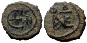 Justin II (565-578) AE Pentanummium, (Bronze, 1.64 g. 12mm.) Constantinople. 565-578 AD.
Obv: Justin II monogram.
Rev: Large epsilon, officina letter ...
