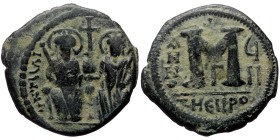Justin II, with Sophia (565-578) AE follis (Bronze, 30mm, 13.58g) Theoupolis (Antioch) mint Dated RY 7 (571/572).
Obv: Justin and Sophia seated facin...