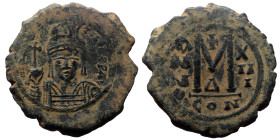 Maurice Tiberius (582-602) (?) AE Follis. (Bronze, 12.37 g. 31mm.) Constantinople. 582-602 AD.
Obv: Frontal bust of Maurice in cuirass and plumed helm...