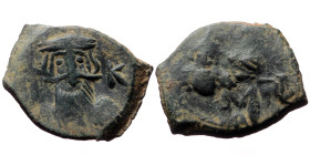 Constans II, Constantine IV, Heraclius, and Tiberius, AE, Follis, (Bronze, 4.99 g. 20mm.) Constantinople. 641-668 AD.
Obv: Constans bust facing with l...