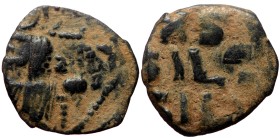 Cliped byzantine AE Follis (Bronze, 1.72g, 17mm) issued in the time of Constantine IX (1042-1055 AD).