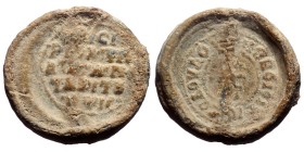 PB Byzantine lead seal (c. 10th century AD).
Obv: A patriarchal cross mounted on a base of three steps. Within concentric borders of dots, a circular...